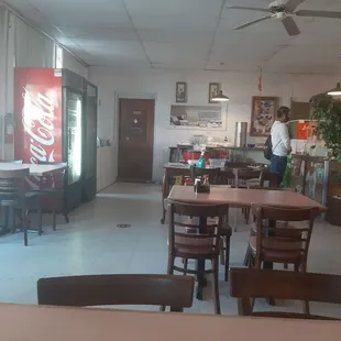 a restaurant with tables and chairs