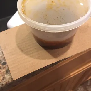 They used cardboard to separate/stabilize my soup in my to go bag.