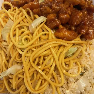 noodles, meat, and vegetables in a styrofoam container