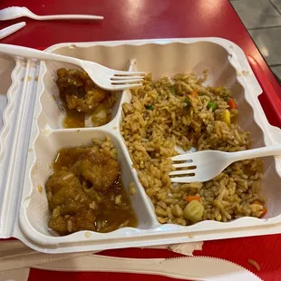 rice, meat, and vegetables with chopsticks