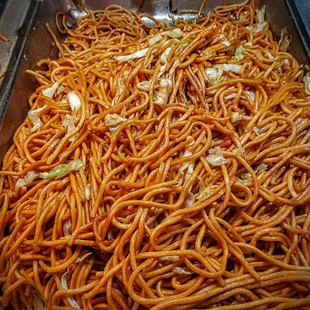 a pan full of noodles and meat