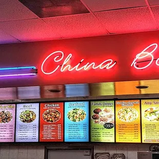 a neon sign above the counter