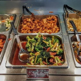 a variety of food in a buffet