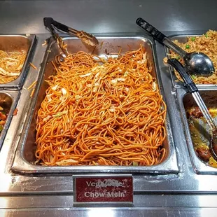 a variety of food items in a buffet