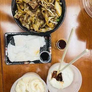 Beef brisket chow foon, bbq pork bun, shrimp rice noodle crepe, and chicken jumbo bao