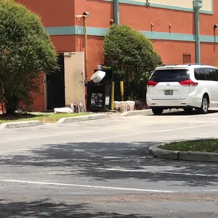 Pan of rice holding garbage can door