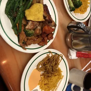 three plates of food on a table