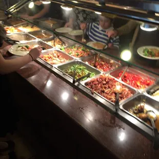 a group of people at a buffet
