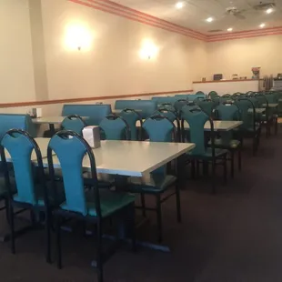 Part of the seating - tables in the middle, booths along the walls.