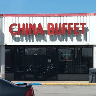 a car parked in front of the restaurant