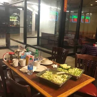 Definite health code violation. Not shown here is the young girl who was chopping shown vegetables and touching her hair and face.