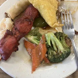 a plate of food with meat and vegetables