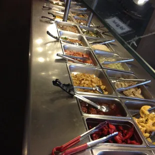 a variety of food in a buffet