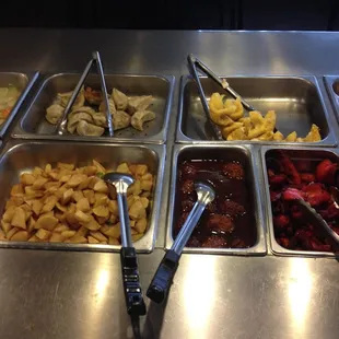a variety of food items in trays