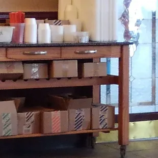 Table with condiments and utensils