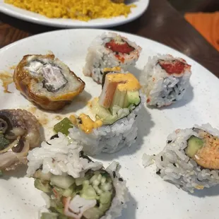 a plate of sushi and a plate of rice
