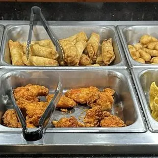 a variety of food items in trays