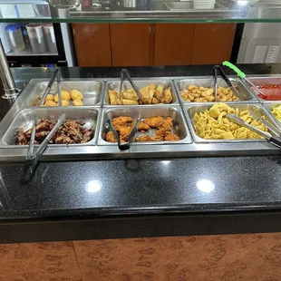 a variety of food items in a buffet