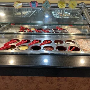 a variety of condiments in a buffet