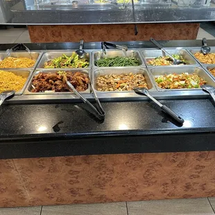 a variety of food in a buffet
