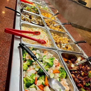 a variety of food in a buffet