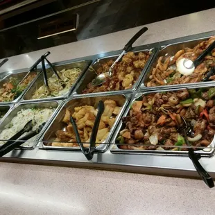 a variety of food items in a buffet