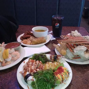 a variety of seafood dishes on a table