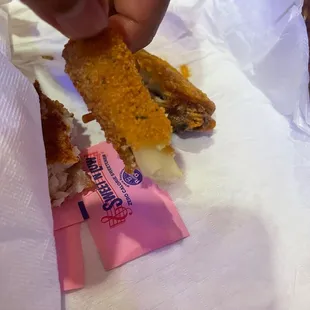 a person picking up a piece of food