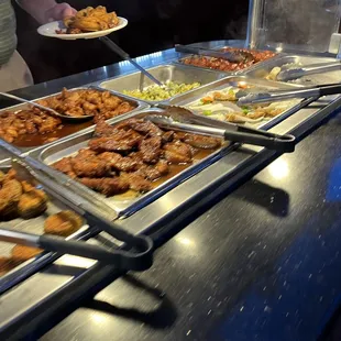 a buffet full of different types of food