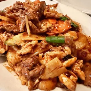a plate of food with meat and vegetables