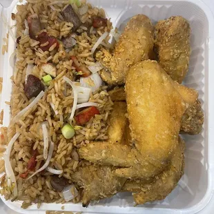 fried chicken and rice in a styrofoam container