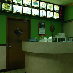 the counter and menus of a chinese restaurant