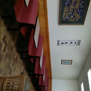 a row of red chairs in a chinese restaurant