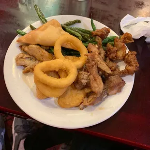 Chicken, crab Rangoon, nuggets, onion rings, and string beans