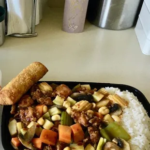 Combination Kung Pao Chicken w/egg roll and white rice! Yummy with peanuts, baby corn, and other mixed fresh veggies!