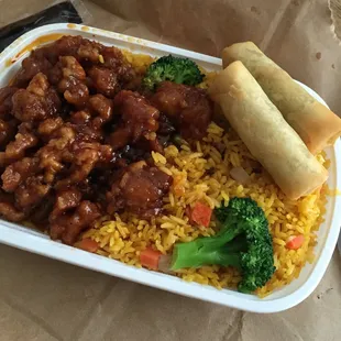 General Tso chicken with fried rice and veggie egg rolls