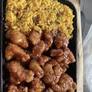 a tray of chicken and rice