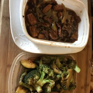 two containers of food on a table