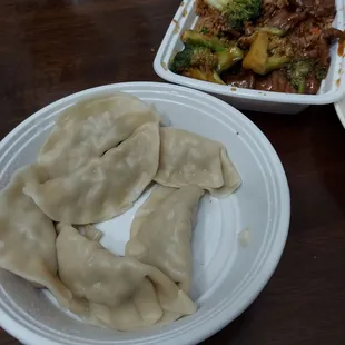 Slightly grazed on Beef and broccoli and steamed dumplings