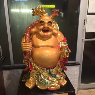 a statue of a laughing buddha