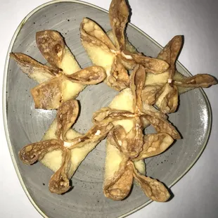 a plate of fried food on a table