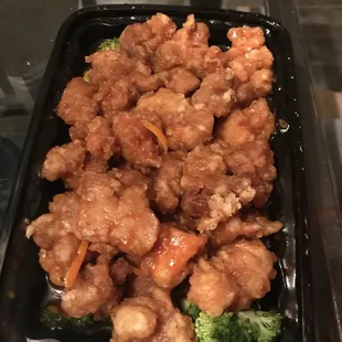 a tray of chicken and broccoli