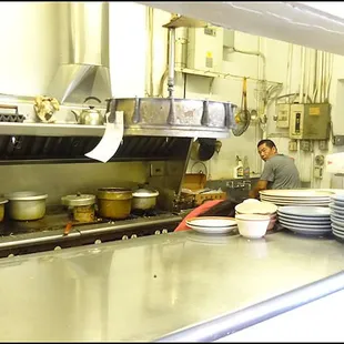 The chef seems a little surprised as I peek through the window to the kitchen and snap his photo.