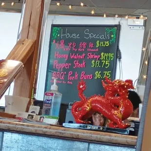 Special board in the back behind checkout