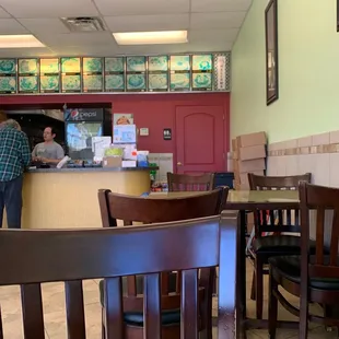 a man and a woman standing at a counter