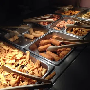 a buffet with many different types of food