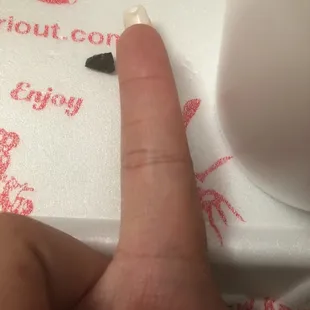 a person&apos;s finger and thumbnail
