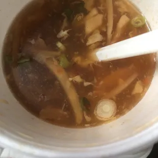 a bowl of soup with a spoon in it