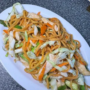 a plate of noodles and vegetables