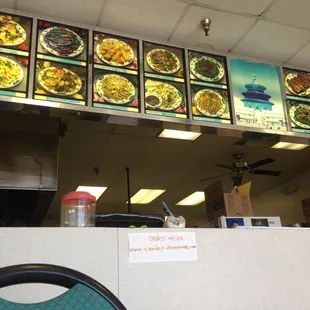 menus on the wall above the counter